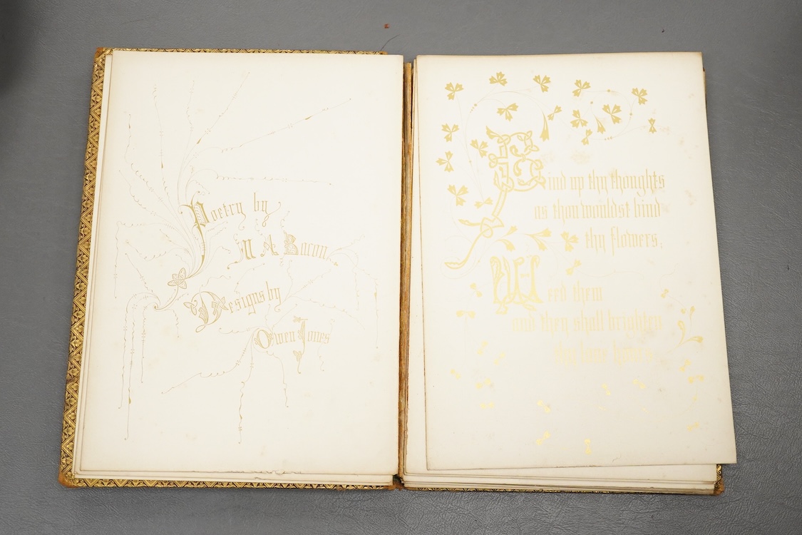 Two early 20th century stamped leather books with illuminated pages, calligraphy and floral designs